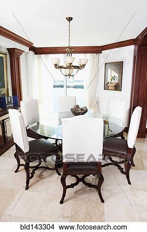 Table and chairs in ornate dining room View Large Photo Image Picture - Table and chairs in ornate dining room. Fotosearch