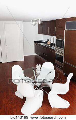Table, counters and cabinets in modern kitchen View Large Photo Image Stock Photo - Table, counters and cabinets in modern kitchen. Fotosearch