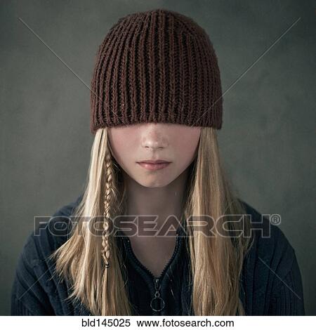 Teenage girl wearing knitted cap over eyes View Large Photo Image Stock Photography - Teenage girl wearing knitted cap over eyes. Fotosearch