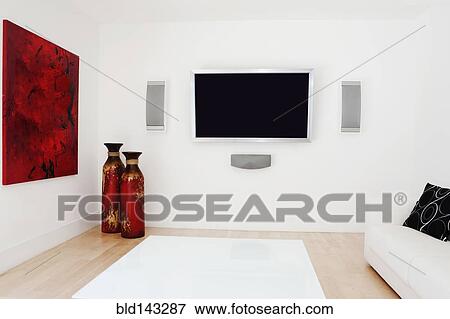 Stock Photo - Television, rug and wall art in modern living room. Fotosearch
