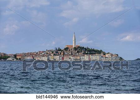 Tower and coastal village on ocean, Rovinj, Istria, Croatia View Large Photo Image Stock Photograph - Tower and coastal village on ocean, Rovinj, Istria, Croatia. Fotosearch