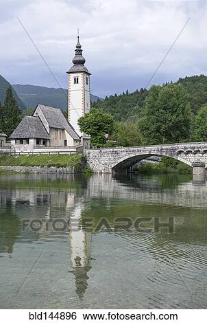 Tower, bridge and building reflected in still lake View Large Photo Image Stock Photograph - Tower, bridge and building reflected in still lake. Fotosearch
