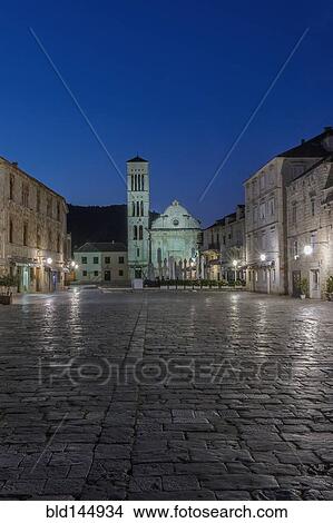 Picture - Town square and buildings illuminated at night, Hvar, Split, Croatia. Fotosearch