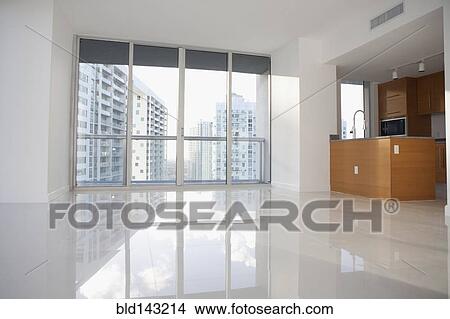 Windows and reflective floor in empty modern apartment View Large Photo Image Picture - Windows and reflective floor in empty modern apartment. Fotosearch