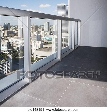 Stock Image - Windows and tile floor in empty apartment. Fotosearch