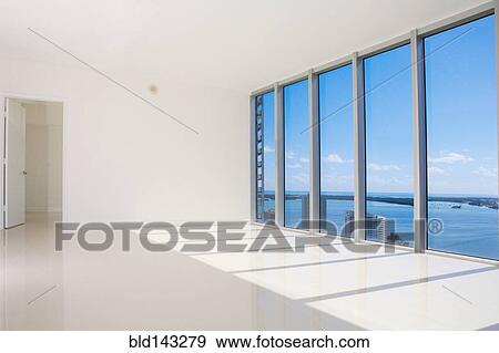 Windows in empty modern living space View Large Photo Image Stock Photo - Windows in empty modern living space. Fotosearch