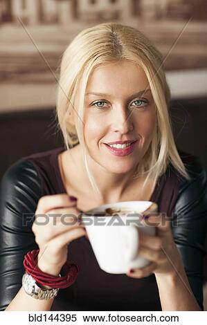 Stock Photography - Woman drinking cup of coffee. Fotosearch