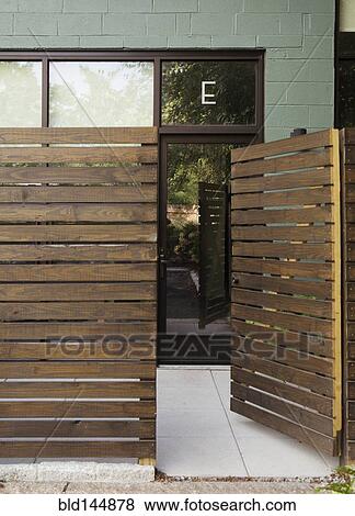 Wooden entrance to modern condo building View Large Photo Image Stock Photo - Wooden entrance to modern condo building. Fotosearch