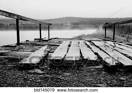Stock Photo - Wooden planks on platform on beach. Fotosearch