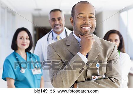 Administrator, doctors and nurse in hospital View Large Photo Image Stock Photography - Administrator, doctors and nurse in hospital. Fotosearch