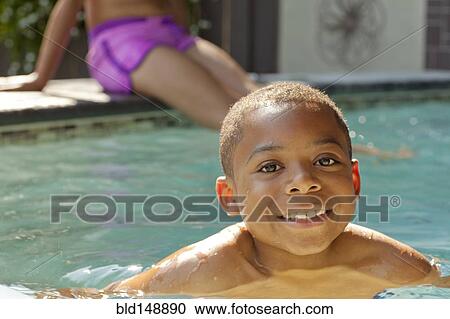 African American boy swimming in swimming pool View Large Photo Image Stock Image - African American boy swimming in swimming pool. Fotosearch