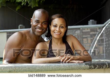 African American couple enjoying swimming pool View Large Photo Image Stock Photo - African American couple enjoying swimming pool. Fotosearch