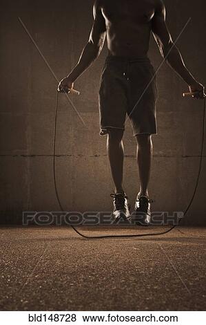 African American man jumping rope View Large Photo Image Stock Photo - African American man jumping rope. Fotosearch