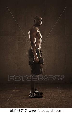 African American man lifting weights View Large Photo Image Stock Photo - African American man lifting weights. Fotosearch
