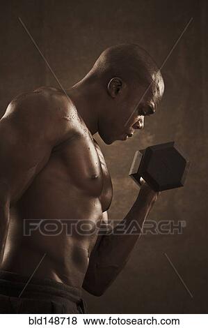 African American man lifting weights View Large Photo Image Stock Photo - African American man lifting weights. Fotosearch