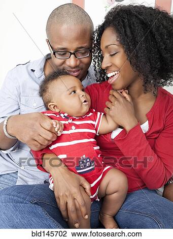 African American parents smiling at baby son View Large Photo Image Stock Image - African American parents smiling at baby son. Fotosearch