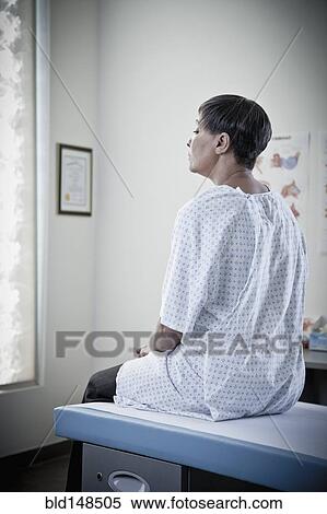 African American woman waiting in examination room View Large Photo Image Stock Photography - African American woman waiting in examination room. Fotosearch