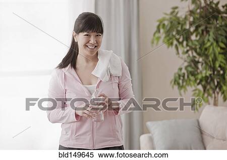 Asian woman relaxing after exercise View Large Photo Image Stock Photography - Asian woman relaxing after exercise. Fotosearch