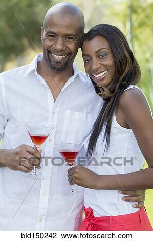 Black couple drinking martinis View Large Photo Image Stock Image - Black couple drinking martinis. Fotosearch