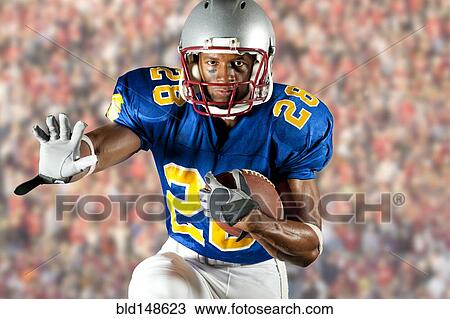 Black football player running with football View Large Photo Image Stock Image - Black football player running with football. Fotosearch
