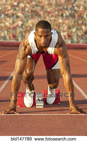 Black runner at starting block in race View Large Photo Image Stock Photo - Black runner at starting block in race. Fotosearch