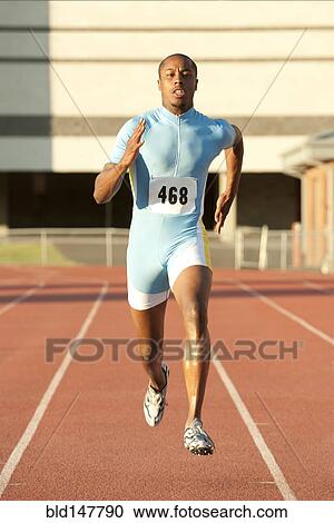 Black runner running on track View Large Photo Image Stock Image - Black runner running on track. Fotosearch