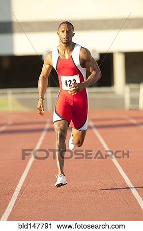 Black runner running on track View Large Photo Image Stock Image - Black runner running on track. Fotosearch