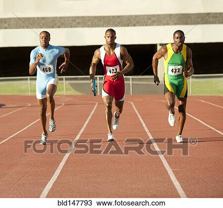 Black runners running on track in relay race View Large Photo Image Stock Image - Black runners running on track in relay race. Fotosearch