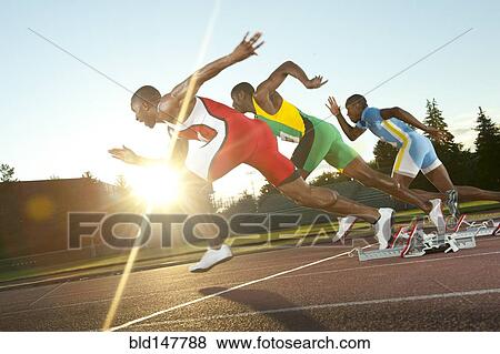 Black runners taking off from starting block in race View Large Photo Image Stock Photo - Black runners taking off from starting block in race. Fotosearch