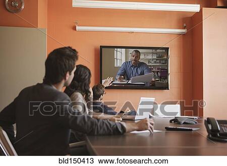 Business people having teleconference in meeting View Large Photo Image Stock Image - Business people having teleconference in meeting. Fotosearch