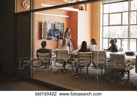 Business people having teleconference in meeting View Large Photo Image Stock Image - Business people having teleconference in meeting. Fotosearch