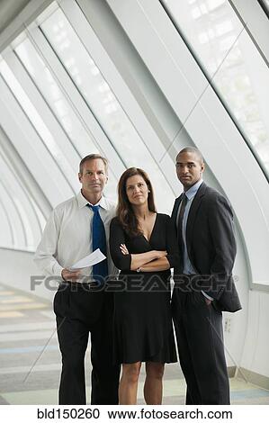 Stock Image - Business people standing together. Fotosearch