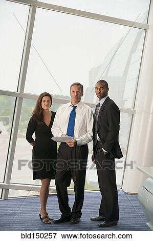 Stock Photo - Business people standing together. Fotosearch