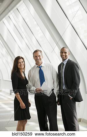 Stock Photo - Business people standing together. Fotosearch
