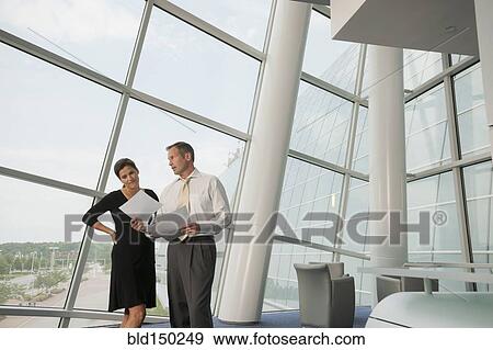 Business people working together in conference room View Large Photo Image Stock Photo - Business people working together in conference room. Fotosearch