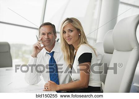 Business people working together in conference room View Large Photo Image Stock Photography - Business people working together in conference room. Fotosearch
