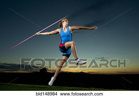 Picture - Caucasian athlete aiming javelin. Fotosearch