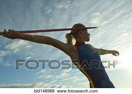 Caucasian athlete aiming javelin View Large Photo Image Stock Photo - Caucasian athlete aiming javelin. Fotosearch