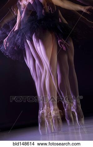 Picture - Caucasian ballerina dancing on stage. Fotosearch