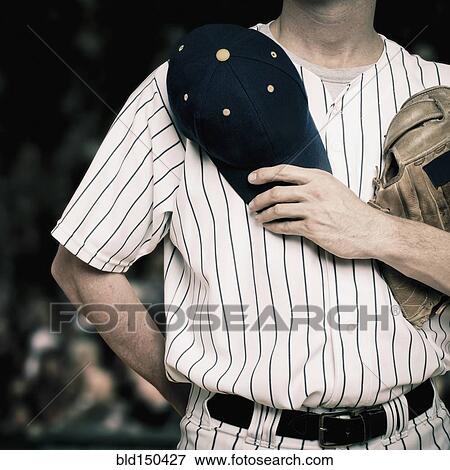 Caucasian baseball player holding hat over heart View Large Photo Image Stock Photo - Caucasian baseball player holding hat over heart. Fotosearch