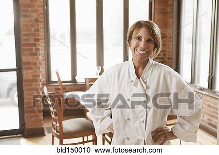 Caucasian chef standing in restaurant View Large Photo Image Stock Image - Caucasian chef standing in restaurant. Fotosearch
