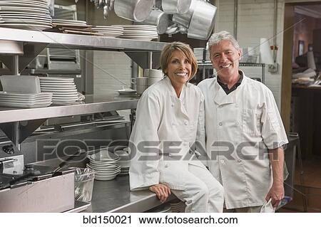 Caucasian chefs in commercial kitchen View Large Photo Image Stock Image - Caucasian chefs in commercial kitchen. Fotosearch