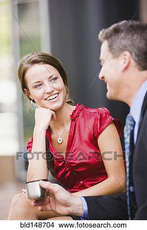 Caucasian co-workers talking outdoors View Large Photo Image Picture - Caucasian co-workers talking outdoors. Fotosearch