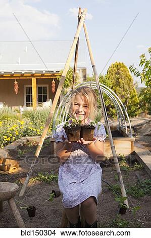 Picture - Caucasian girl gardening. Fotosearch