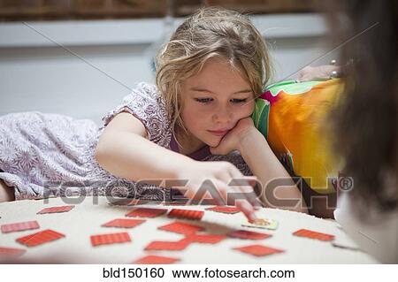 Caucasian girl playing a game View Large Photo Image Stock Image - Caucasian girl playing a game. Fotosearch