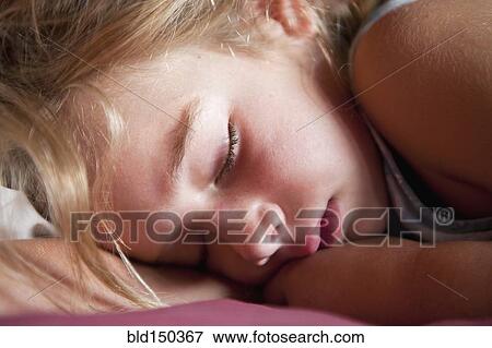 Stock Photo - Caucasian girl sleeping. Fotosearch