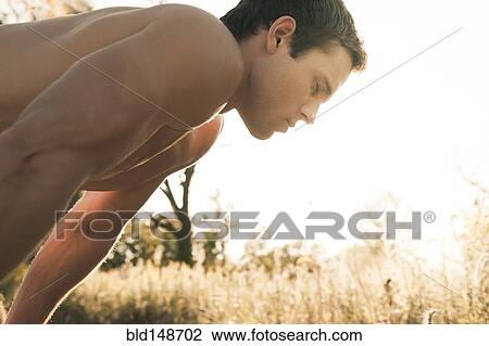 Caucasian man relaxing after exercise View Large Photo Image Stock Image - Caucasian man relaxing after exercise. Fotosearch