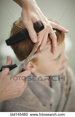 Caucasian mother giving son haircut View Large Photo Image Stock Image - Caucasian mother giving son haircut. Fotosearch