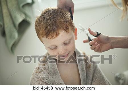 Caucasian mother giving son haircut View Large Photo Image Stock Photo - Caucasian mother giving son haircut. Fotosearch