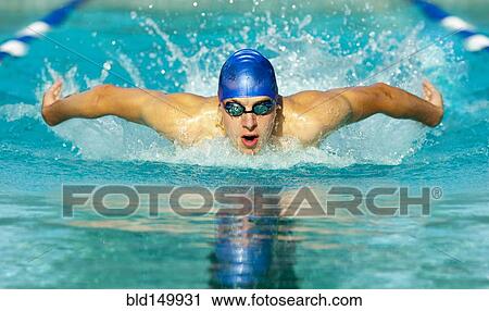 Stock Image - Caucasian swimmer in swimming lane. Fotosearch